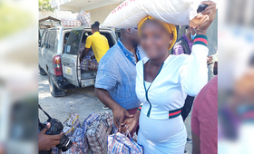 Pregnant woman receiving humanitarian aid 