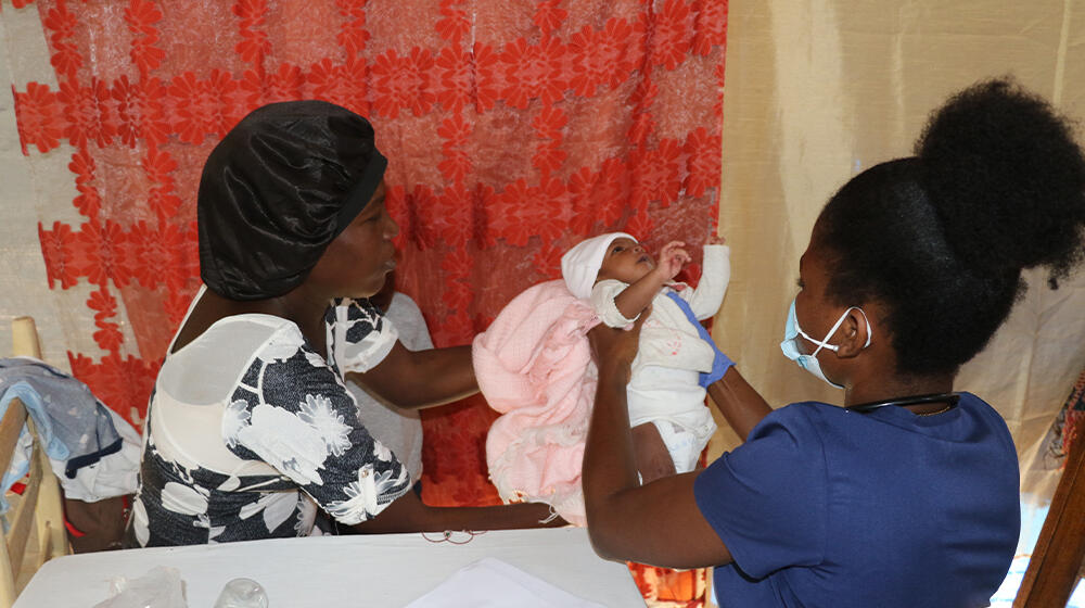 A midwife taking care of a baby