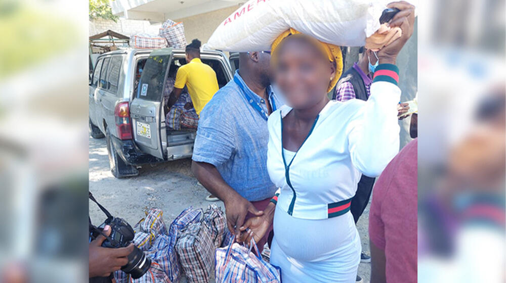 Pregnant woman receiving humanitarian aid 